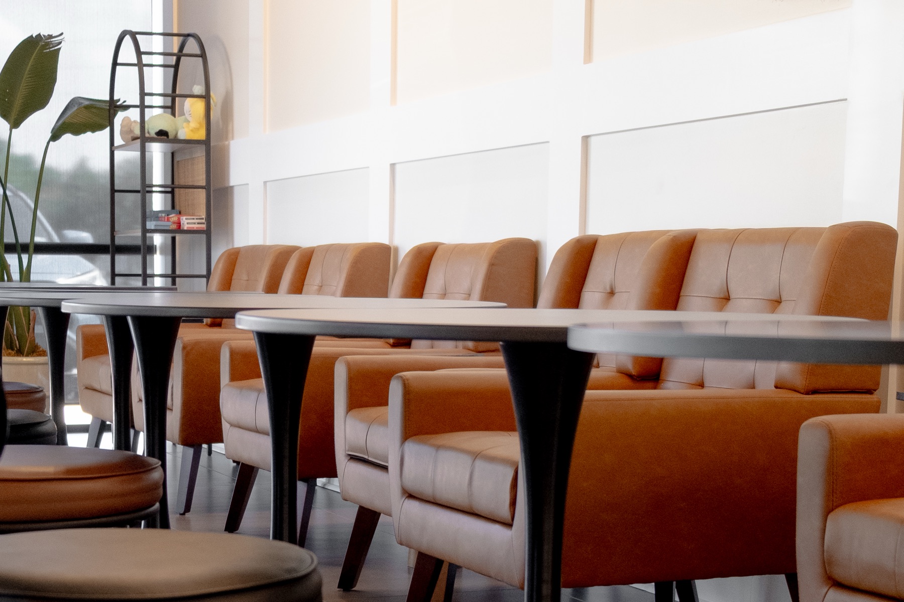 Leather lounge chairs and tables inside Rose Tea House